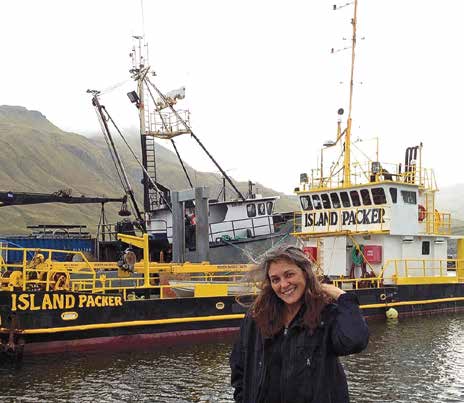 Piama Oleyer with her boat which carries fish from local fishermen to canneries to save time, energy and fuel going back and forth from fishing grounds. She is the Traditional Knowledge Advisor for the Aleut International Association in the TEEB study.